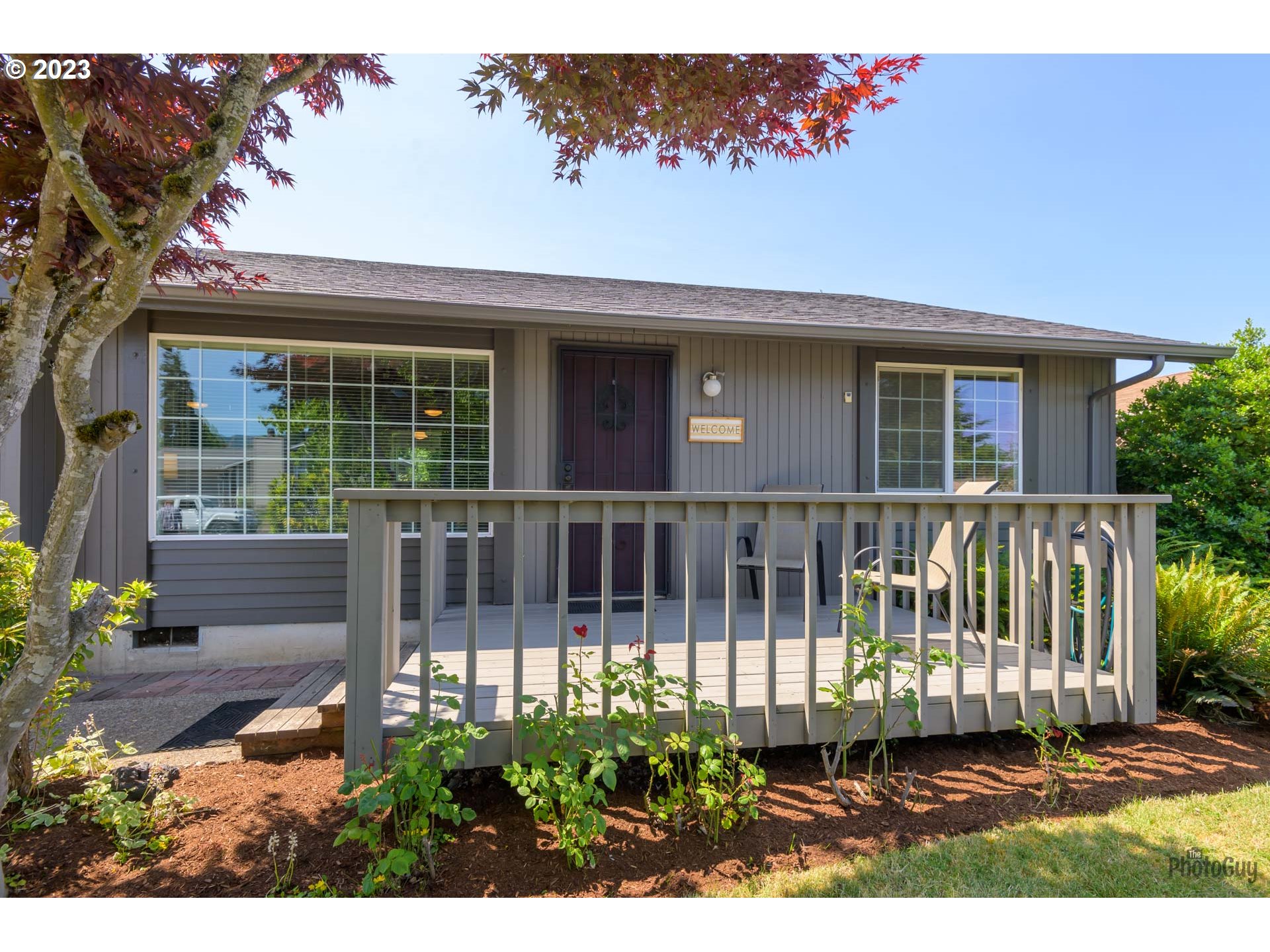 5621 C Street Springfield, OR 97478 - Photo 4 of 29 a front view of a house with a garden