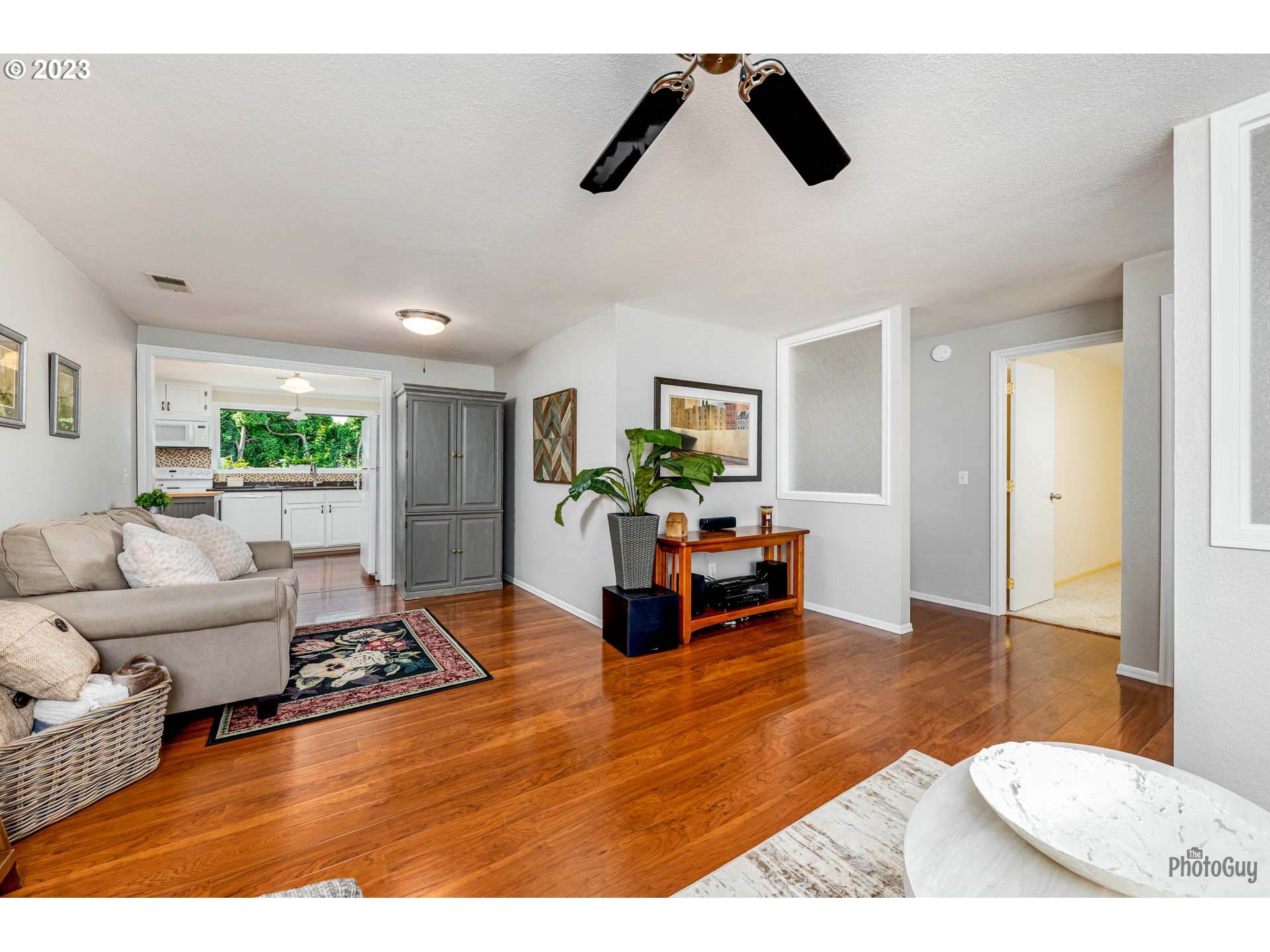 5621 C Street Springfield, OR 97478 - Photo 8 of 29 a living room with furniture and a flat screen tv