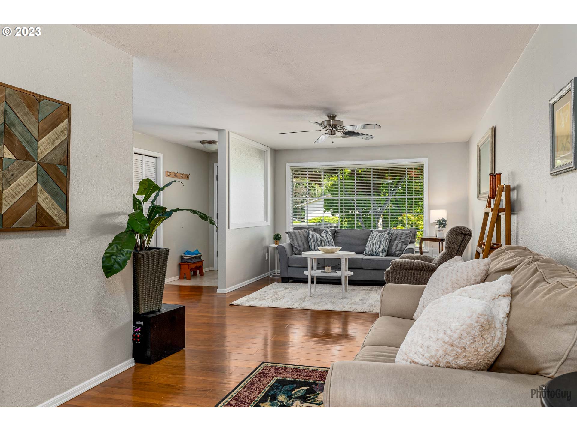 5621 C Street Springfield, OR 97478 - Photo 9 of 29 a living room with furniture and a potted plant