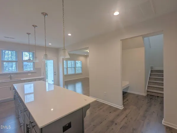 a view of kitchen with cabinets and wooden floor