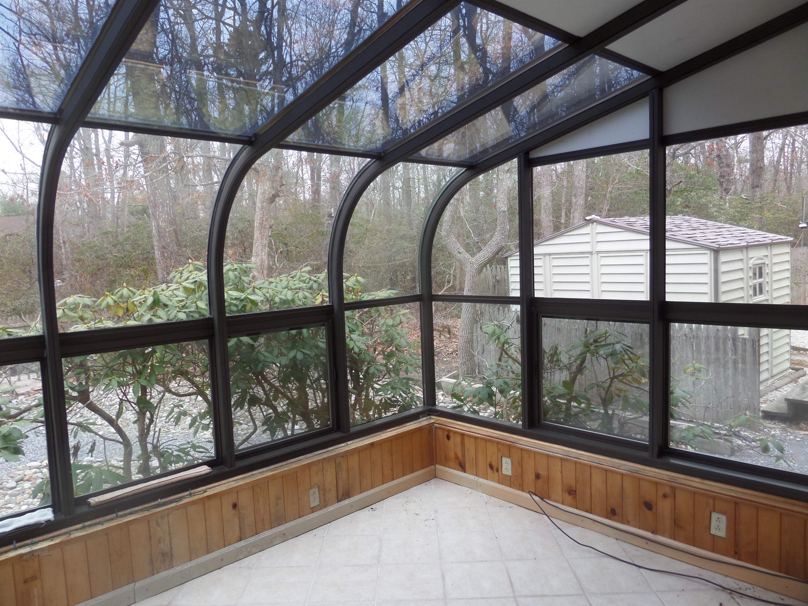 78 Tyler Road Ocean View, NJ 08230 - Photo 11 of 22 a view of empty room with large windows and plants