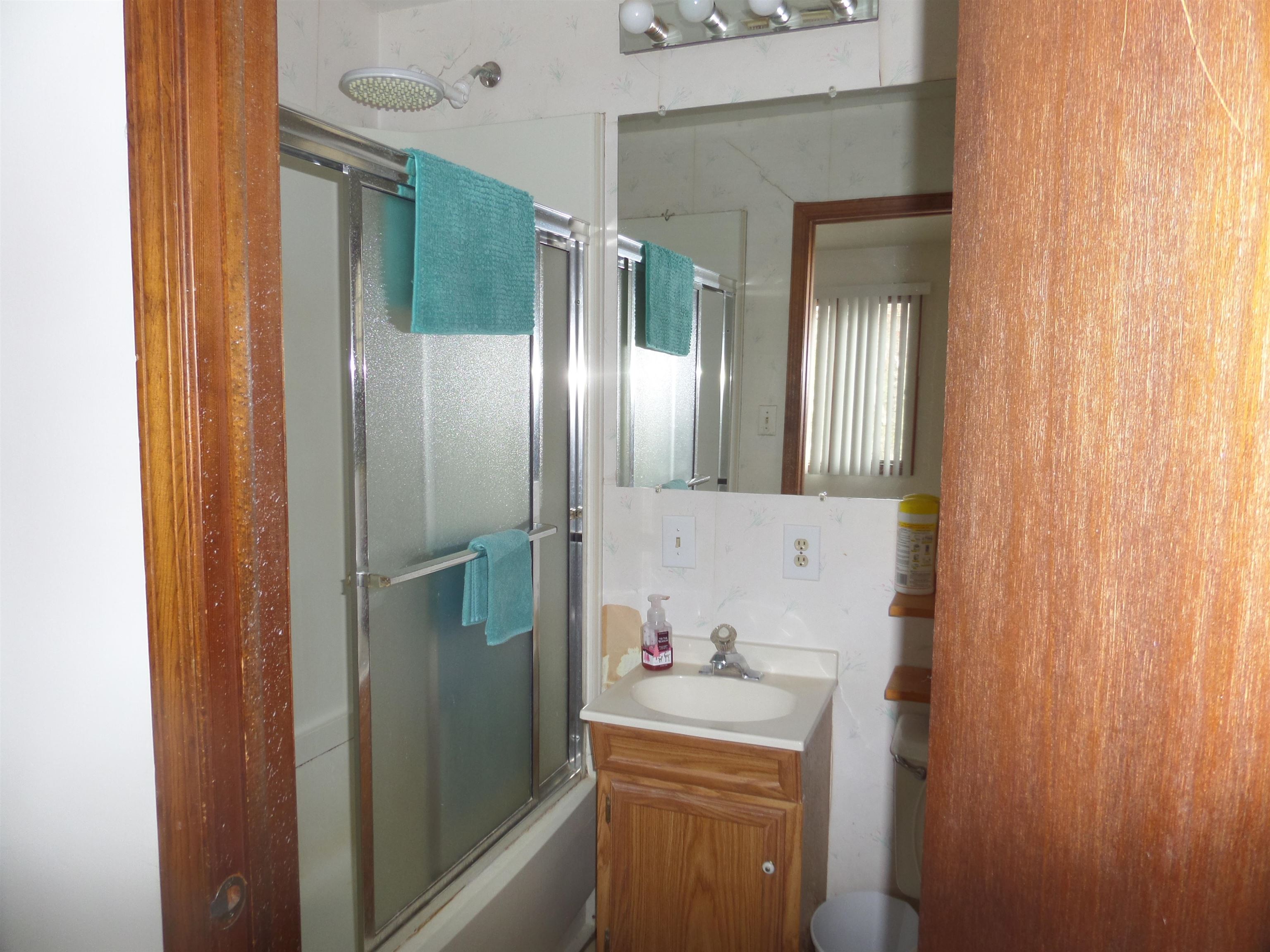 78 Tyler Road Ocean View, NJ 08230 - Photo 17 of 22 a bathroom with a mirror and a shower