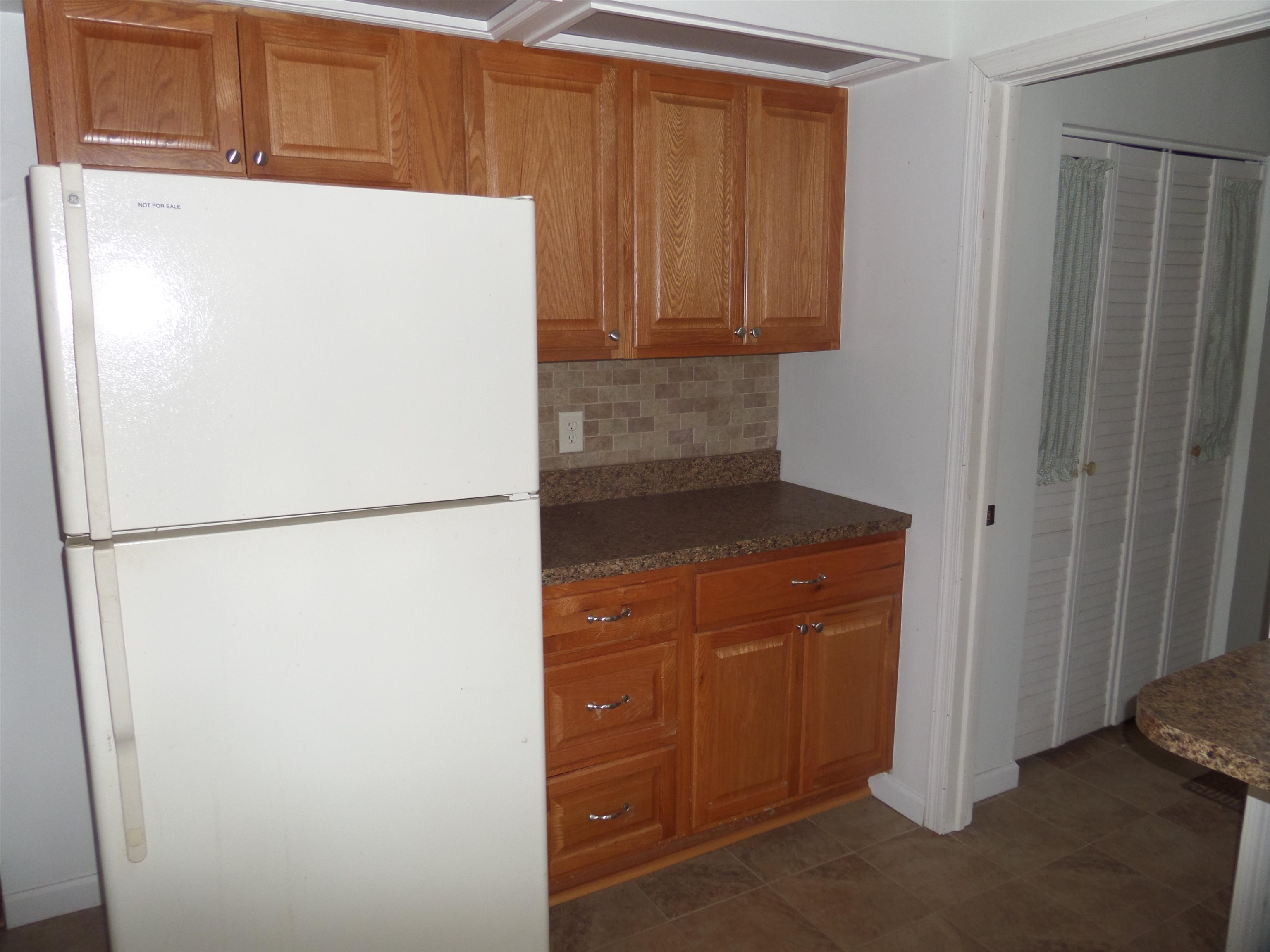 78 Tyler Road Ocean View, NJ 08230 - Photo 7 of 22 a white refrigerator freezer sitting in a kitchen