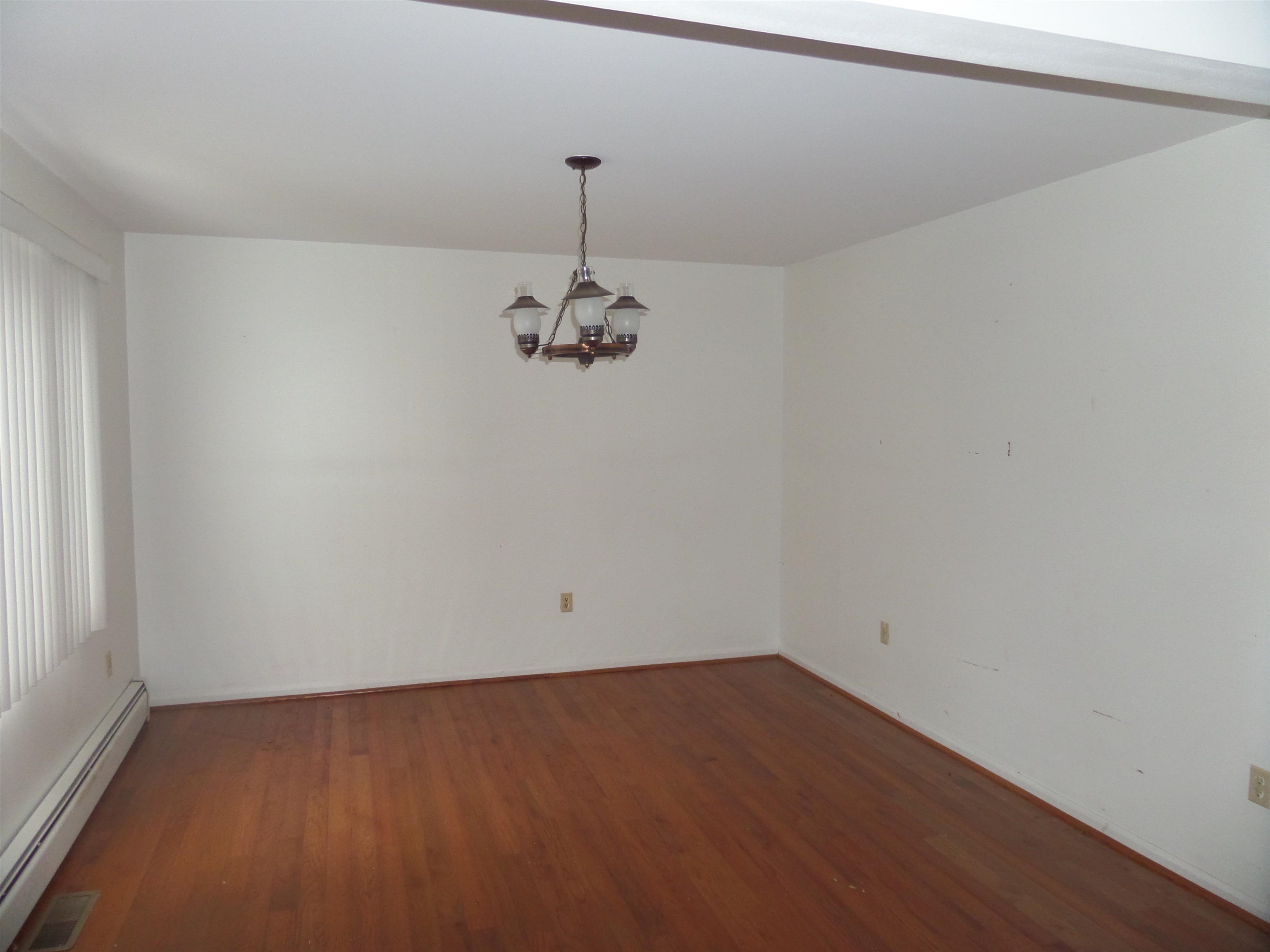78 Tyler Road Ocean View, NJ 08230 - Photo 7 of 22 a view of a room with a hanging light and hardwood floor