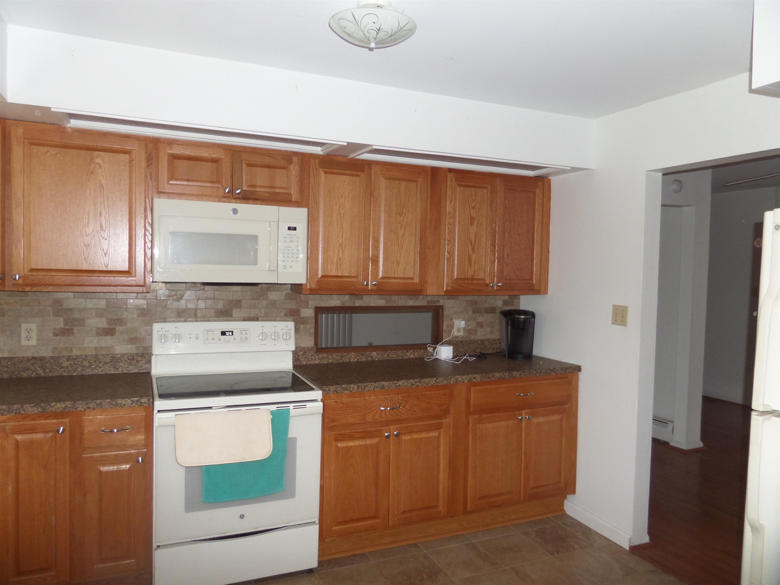 78 Tyler Road Ocean View, NJ 08230 - Photo 8 of 22 a kitchen with appliances cabinets and a counter top space