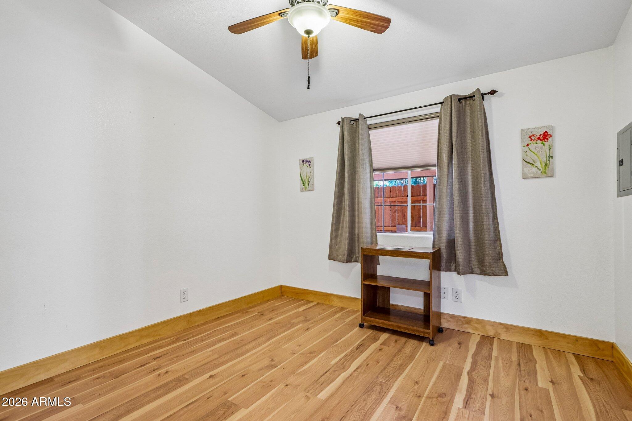 114 South Pinecrest Road Payson, AZ 85541 - Photo 27 of 40 a view of an empty room with wooden floor and a window