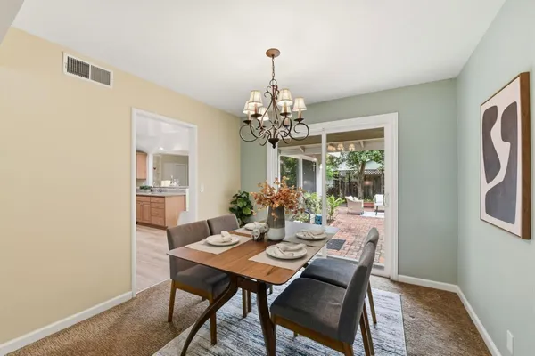 a dining room with furniture and window