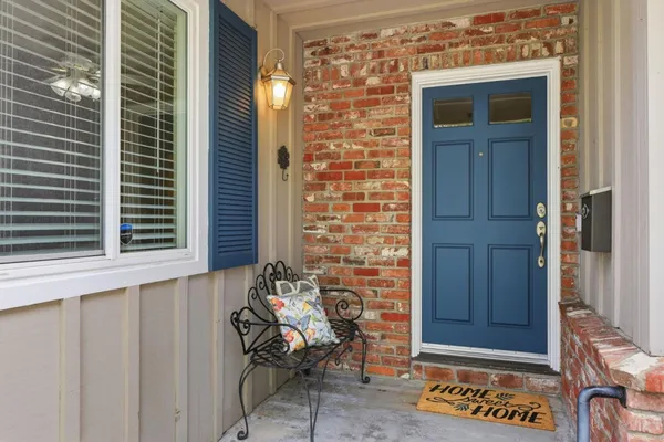 a view of a door and chair in front of door