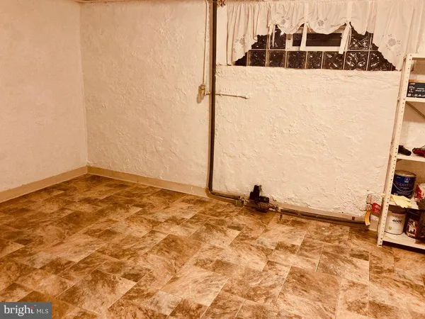 a view of a refrigerator with wooden floor