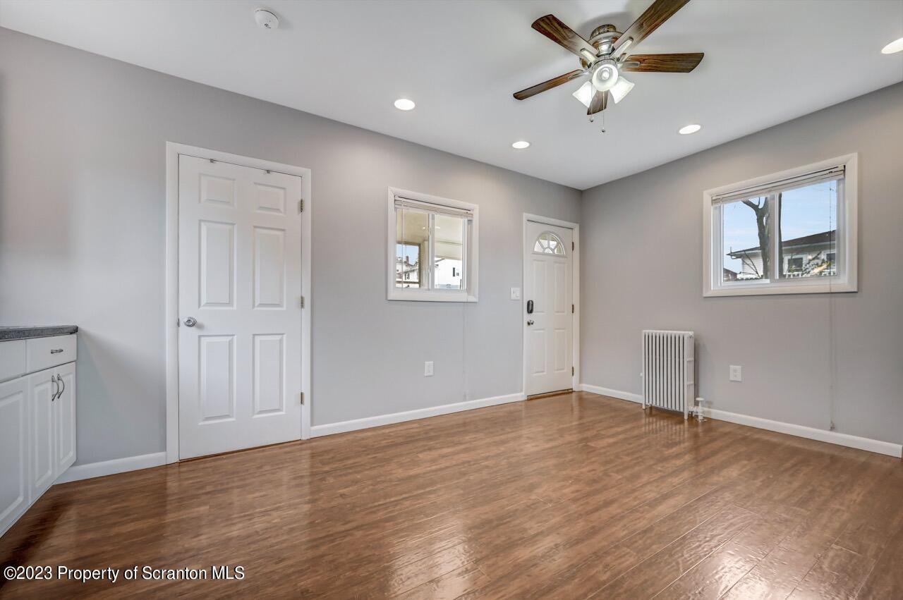 2725 Cedar Avenue Scranton, PA 18505 - Photo 14 of 29 a view of an empty room with window and wooden floor