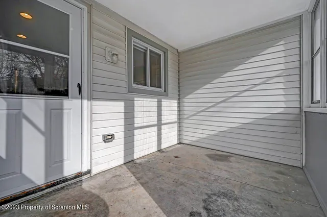 a view of a yard with snow on the road