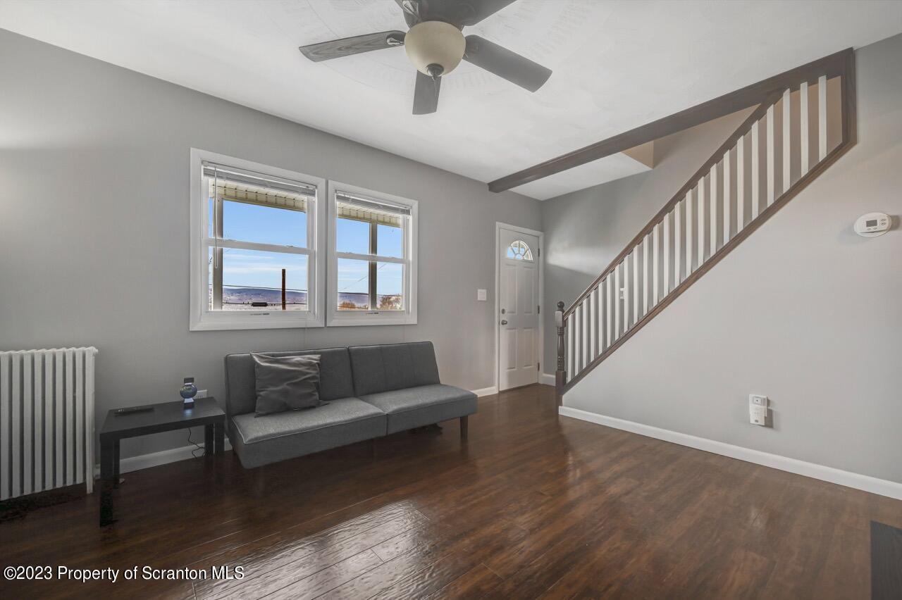 2725 Cedar Avenue Scranton, PA 18505 - Photo 8 of 29 a living room with furniture and a wooden floor