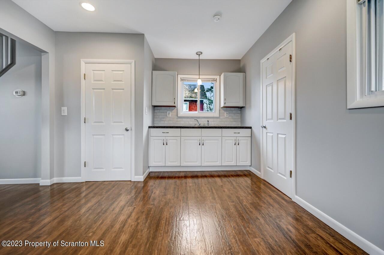 2725 Cedar Avenue Scranton, PA 18505 - Photo 10 of 29 a kitchen with granite countertop a sink and wooden floor