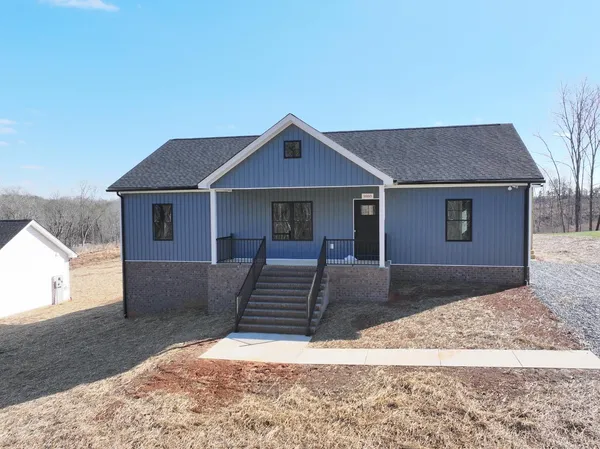 a front view of a house with yard