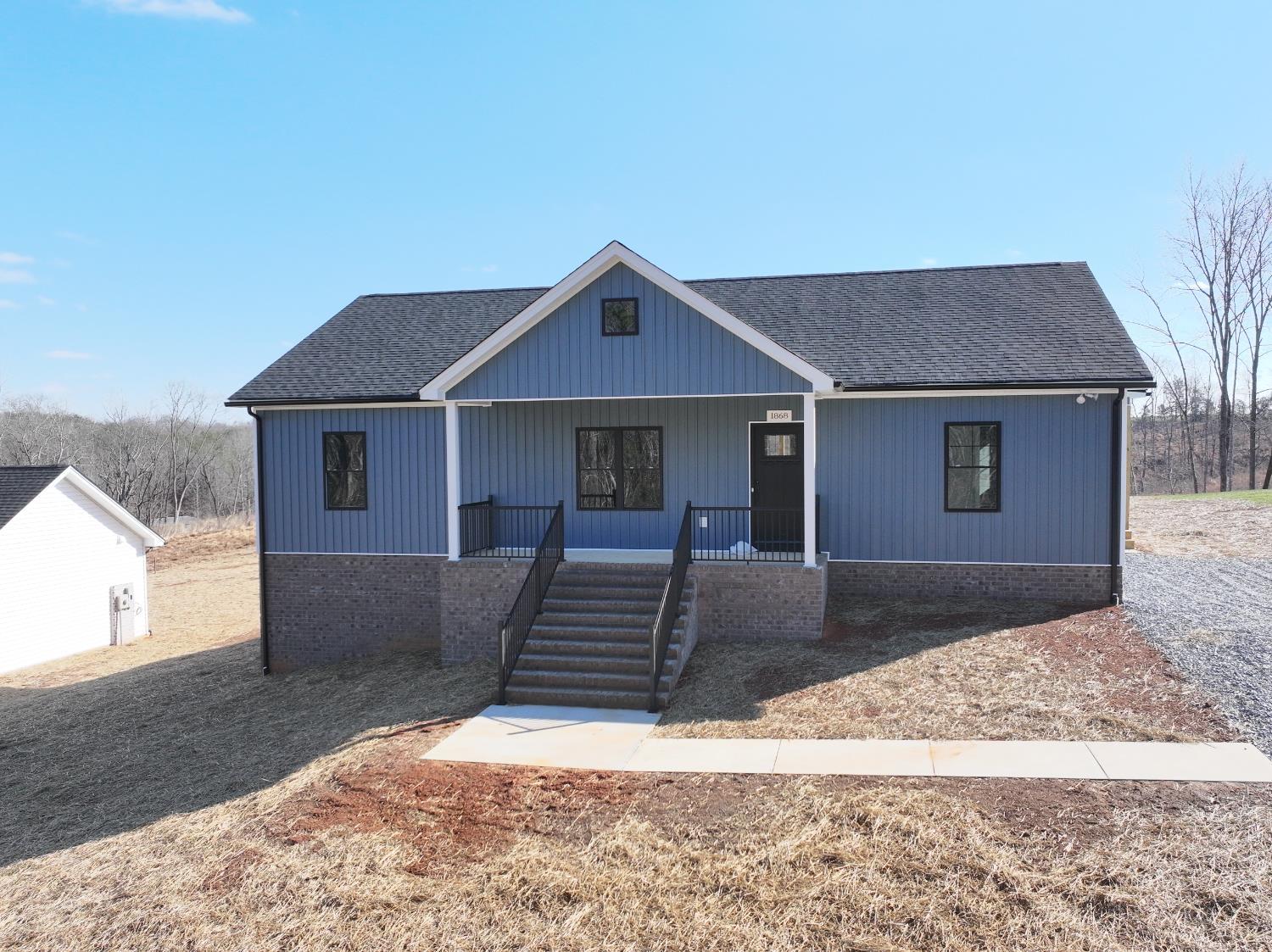 a front view of a house with yard