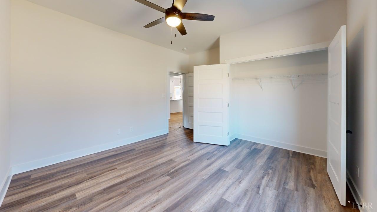 1868 Skinnell Mill Road Bedford, VA 24523 - Photo 12 of 24 a view of an empty room with wooden floor