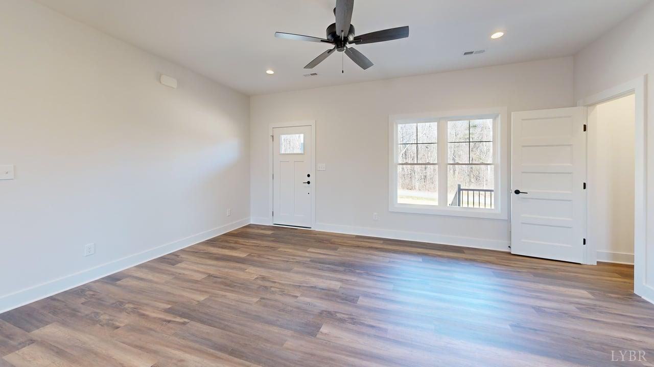1868 Skinnell Mill Road Bedford, VA 24523 - Photo 2 of 24 wooden floor in an empty room with a window