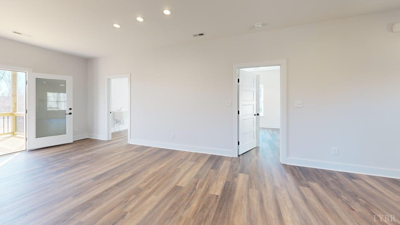 1868 Skinnell Mill Road Bedford, VA 24523 - Photo 3 of 24 wooden floor in an empty room with a window