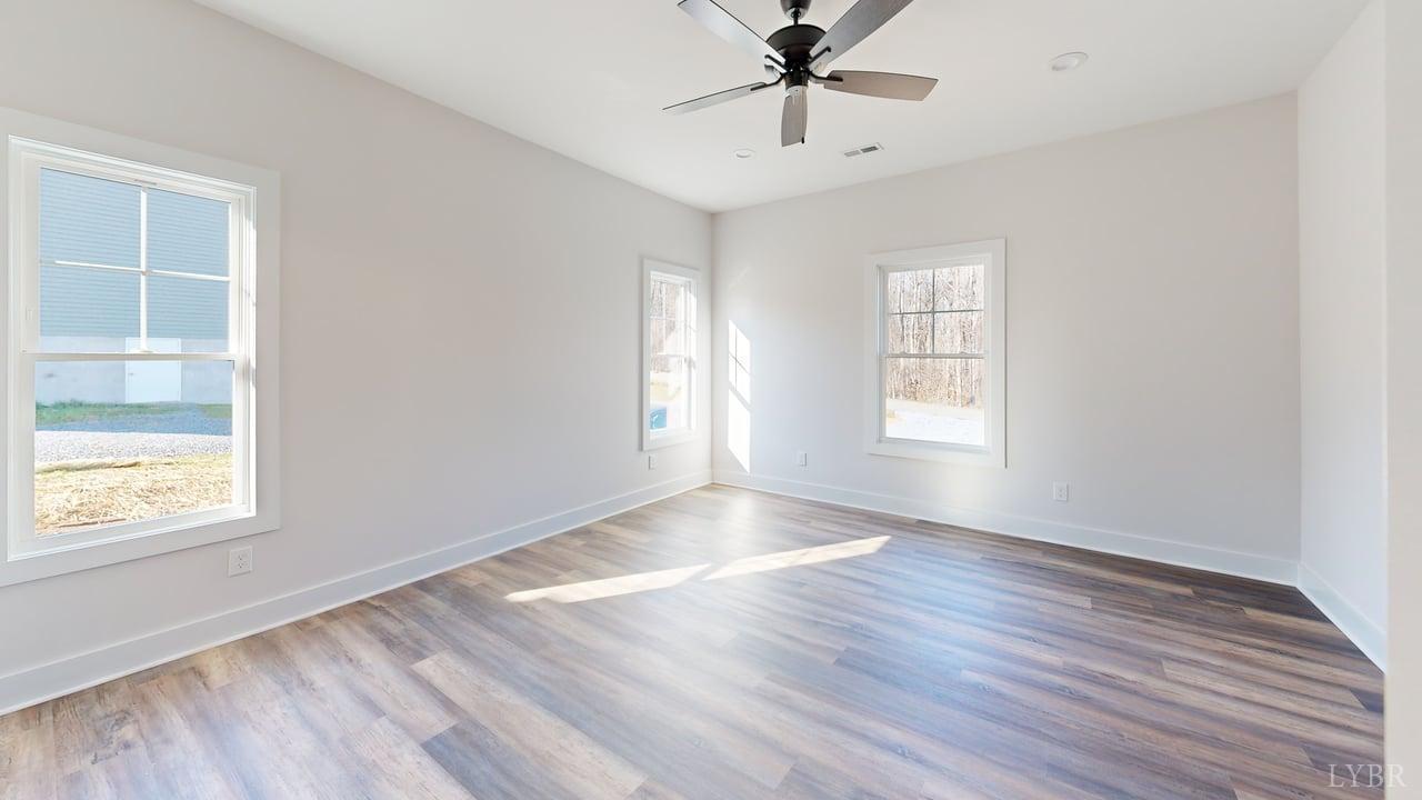 1868 Skinnell Mill Road Bedford, VA 24523 - Photo 10 of 24 wooden floor in an empty room with a window