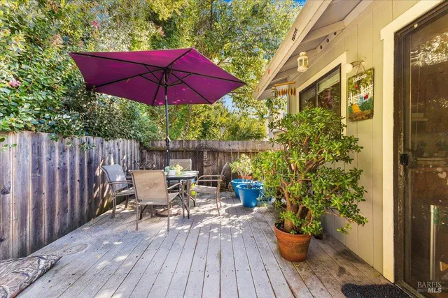 a view of balcony with outdoor seating and wooden floor
