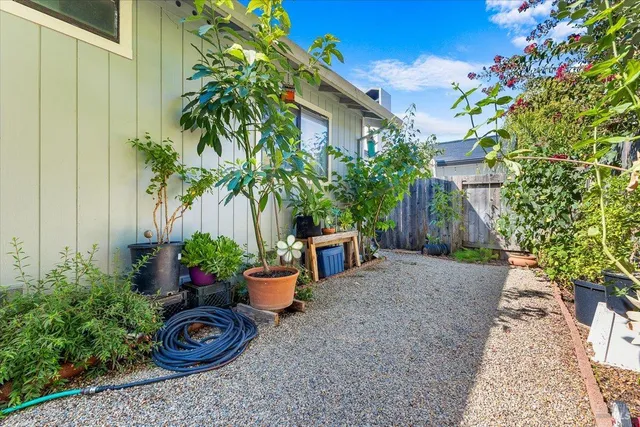 a backyard of a house with outdoor seating