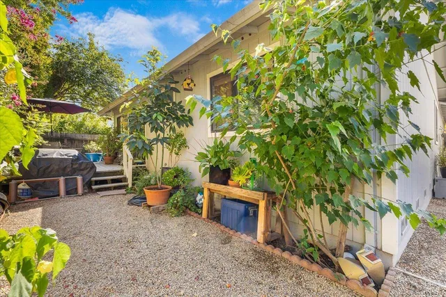 a front view of house with yard and trees