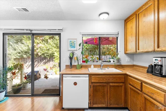 a kitchen with a sink and a window