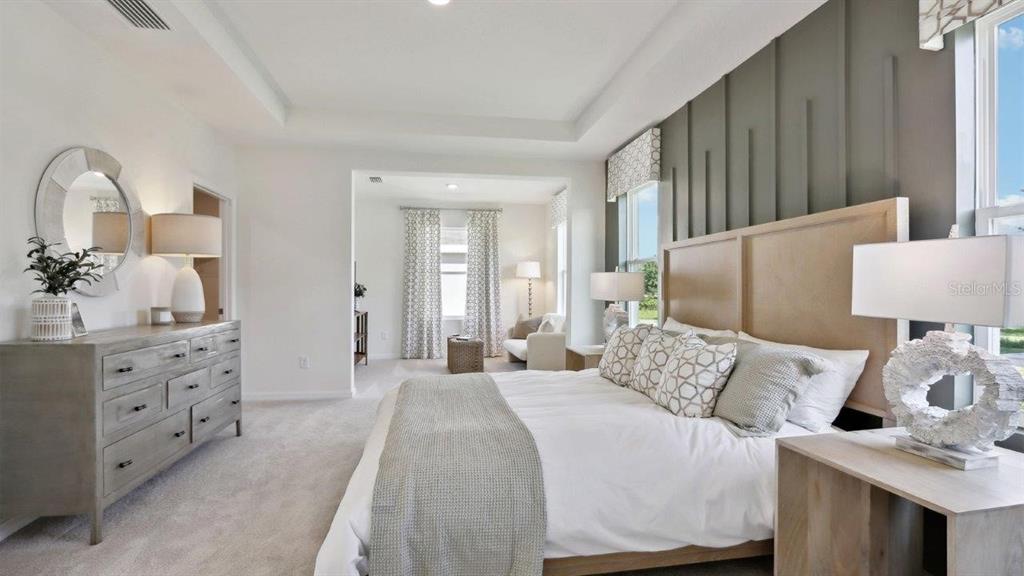 2361 Rikkola Lane Wesley Chapel, FL 33543 - Photo 23 of 28 a bedroom with a bed and a dresser