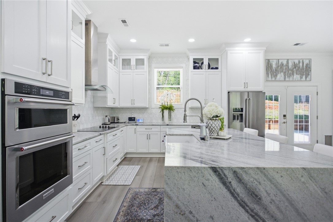 2585 Dr Johns Road Westminster, SC 29693 - Photo 12 of 40 This bright kitchen features sleek appliances and ample counter space for all your culinary needs.