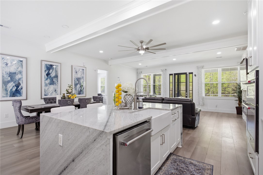2585 Dr Johns Road Westminster, SC 29693 - Photo 13 of 40 An open concept living area features a bright kitchen island and dining space.