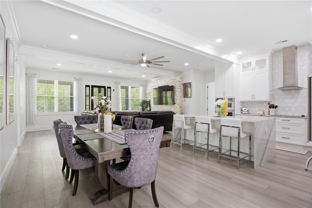 2585 Dr Johns Road Westminster, SC 29693 - Photo 15 of 40 This open concept living space features a dining area, kitchen, and living room with abundant natural light.