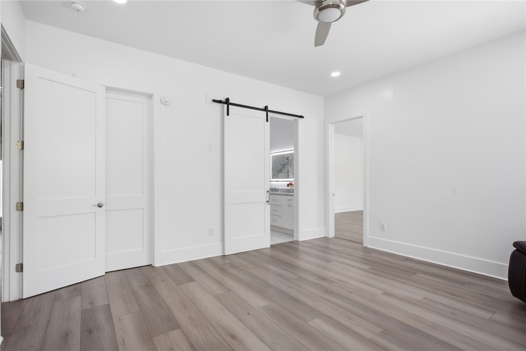 2585 Dr Johns Road Westminster, SC 29693 - Photo 18 of 40 This bright and airy room features sleek flooring, offering a perfect blend of comfort and style.