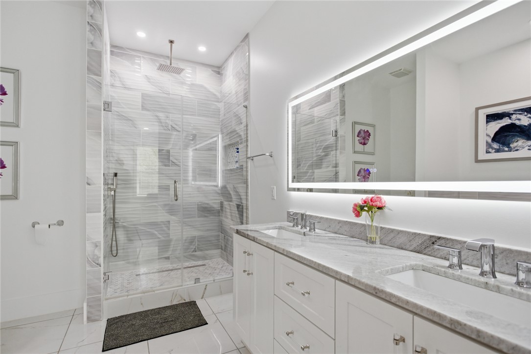 2585 Dr Johns Road Westminster, SC 29693 - Photo 20 of 40 This modern bathroom features a spacious shower and a vanity with dual sinks.