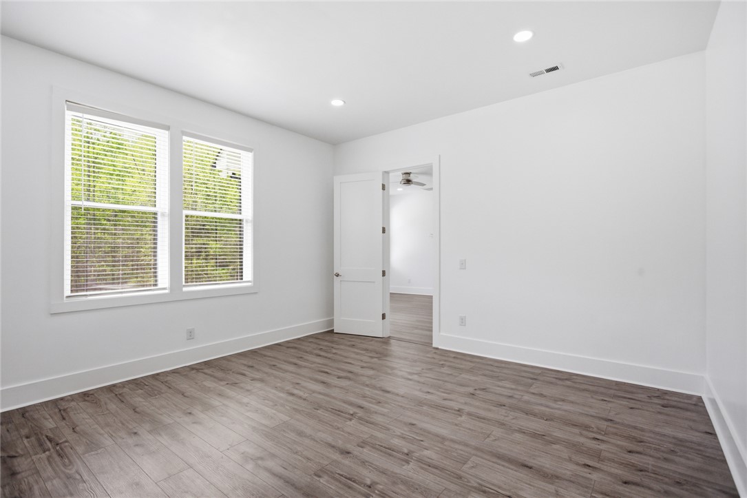 2585 Dr Johns Road Westminster, SC 29693 - Photo 23 of 40 Bright and airy, this room features durable flooring and abundant natural light, creating a versatile living space.