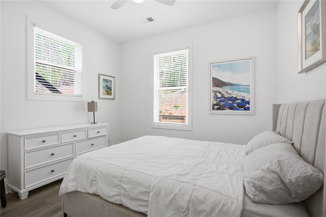 2585 Dr Johns Road Westminster, SC 29693 - Photo 24 of 40 Bright and airy bedroom features sleek flooring and ample natural light through well-placed windows.
