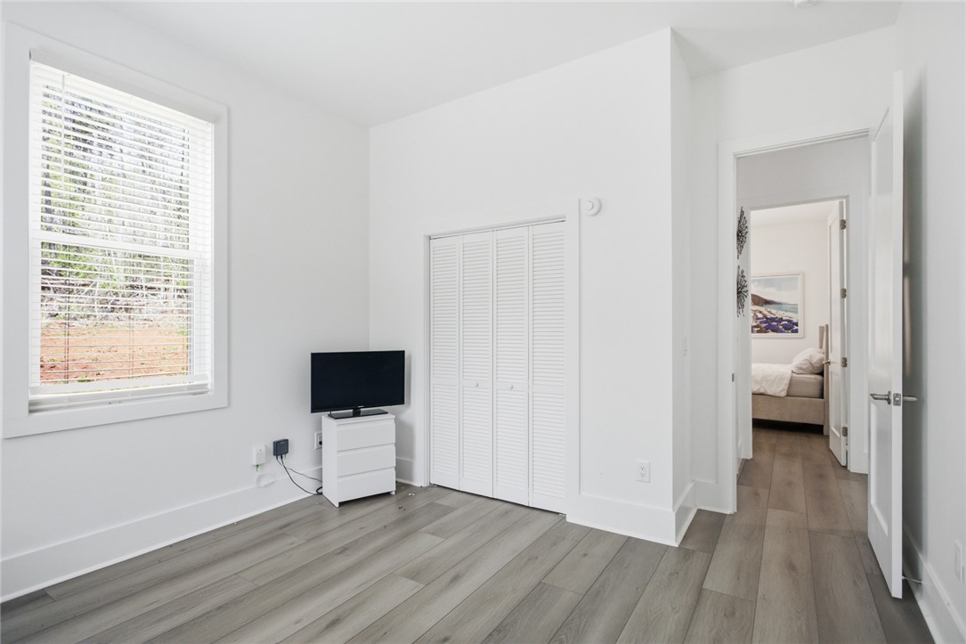 2585 Dr Johns Road Westminster, SC 29693 - Photo 27 of 40 This cozy bedroom features light-toned flooring and a convenient closet.