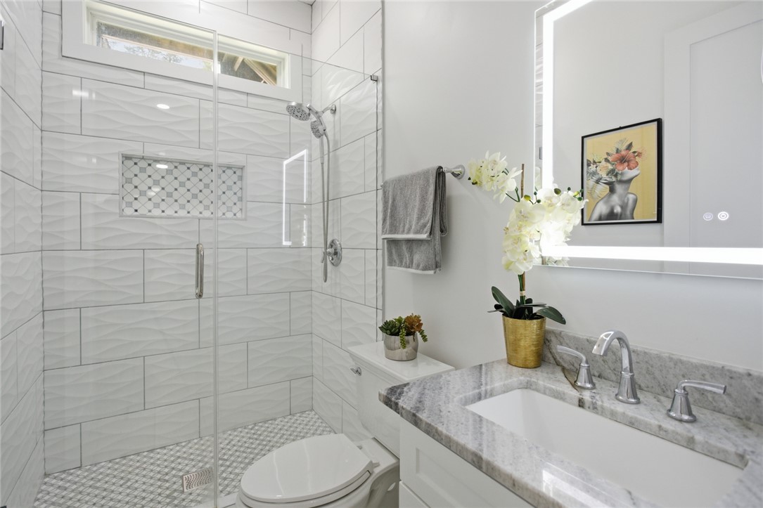 2585 Dr Johns Road Westminster, SC 29693 - Photo 28 of 40 This modern bathroom features a sleek glass shower and elegant vanity.