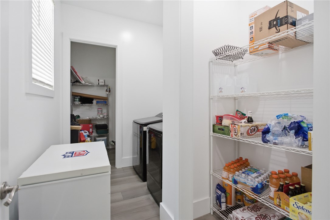 2585 Dr Johns Road Westminster, SC 29693 - Photo 29 of 40 This spacious utility room offers practical storage and laundry amenities for organized living.