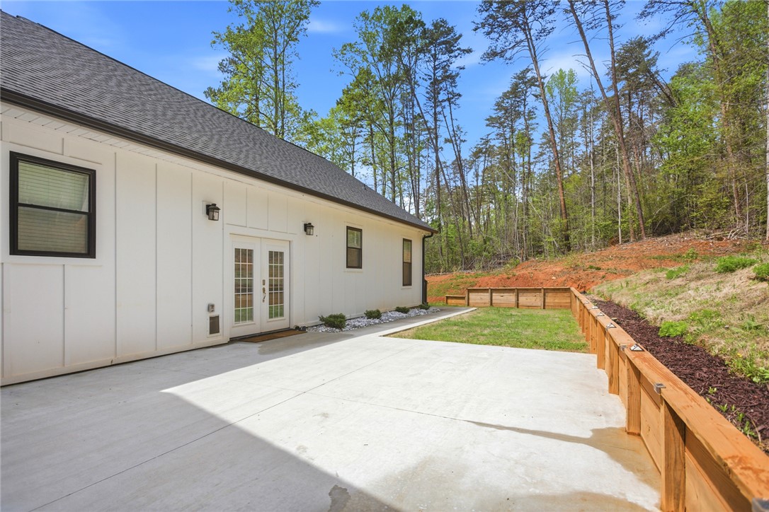 2585 Dr Johns Road Westminster, SC 29693 - Photo 31 of 40 This residence features a patio for outdoor enjoyment, offering a blend of comfort and natural surroundings.