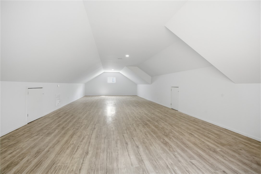 2585 Dr Johns Road Westminster, SC 29693 - Photo 34 of 40 This spacious bonus room features abundant natural light and modern flooring, offering versatile design possibilities.