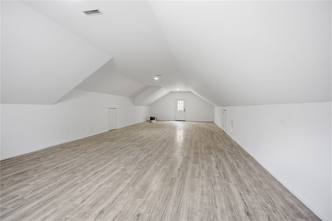 2585 Dr Johns Road Westminster, SC 29693 - Photo 35 of 40 This spacious attic room offers versatile design potential with durable flooring and ample natural light.