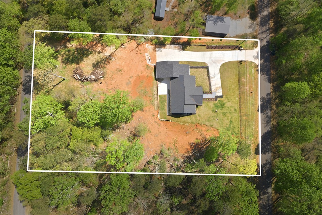 2585 Dr Johns Road Westminster, SC 29693 - Photo 40 of 40 This aerial view showcases a new home nestled within a verdant lot.