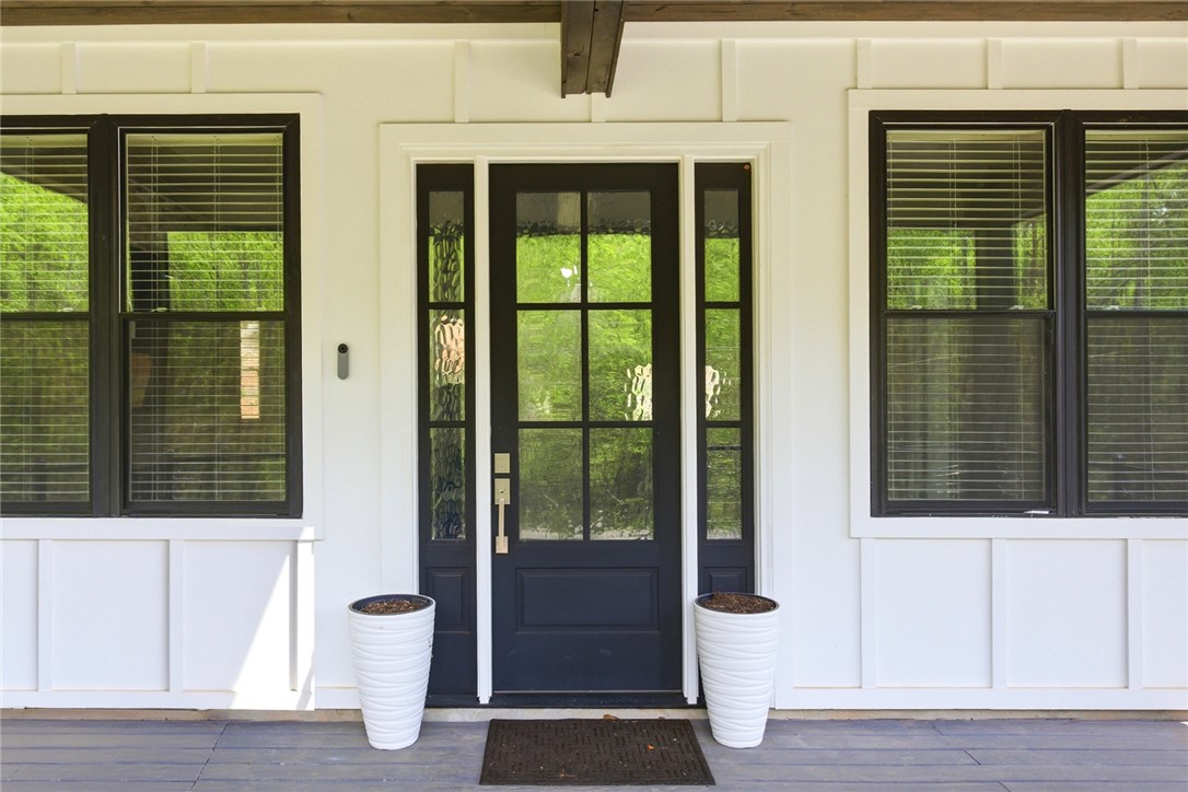 2585 Dr Johns Road Westminster, SC 29693 - Photo 6 of 40 This charming entrance features a classic paneled door and inviting porch space.