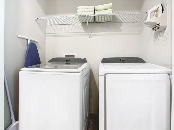 a utility room with dryer and washer
