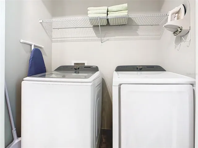 a utility room with dryer and washer