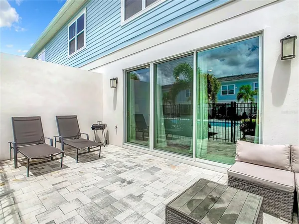 an aerial view of a house with outdoor space tennis court