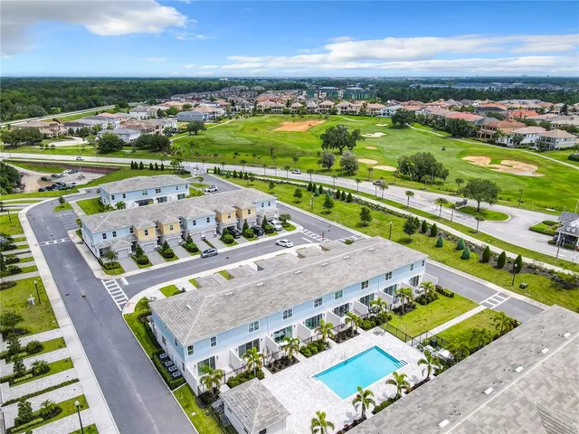 a aerial view of a house with a yard and plants