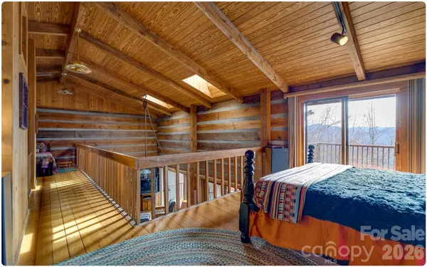 a bedroom with furniture and a window