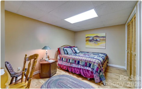 a bedroom with bed and window