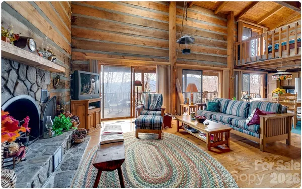 a living room with fireplace furniture and a fireplace